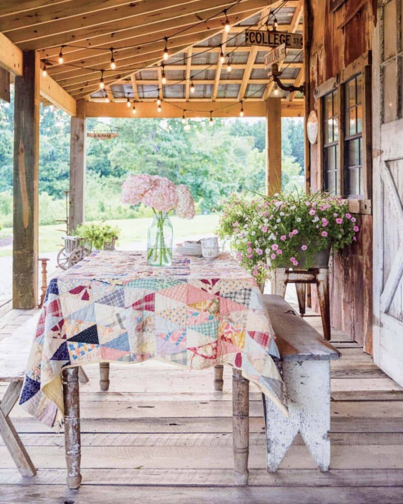covered patio with an outdoor dining table and a quilt tablecloth