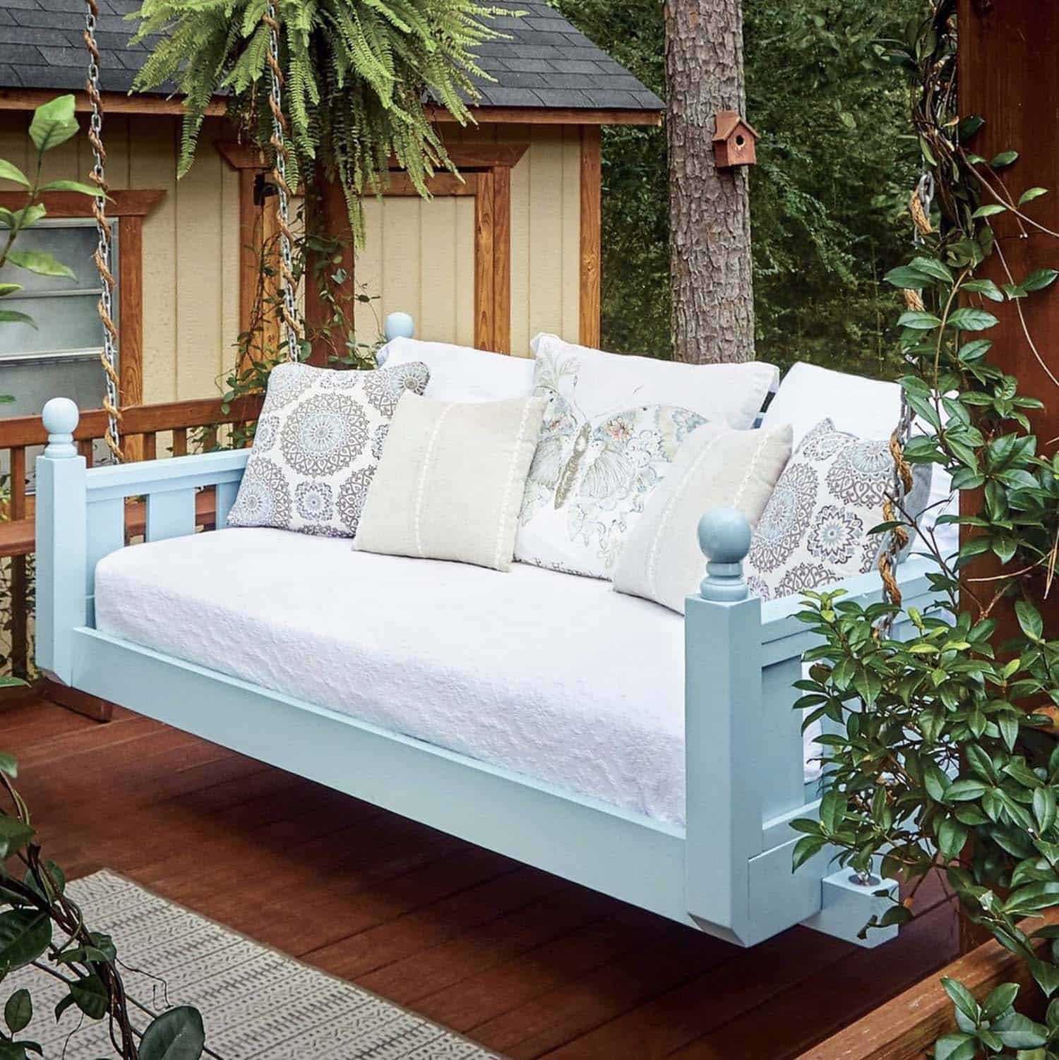inviting porch swing painted in a light blue