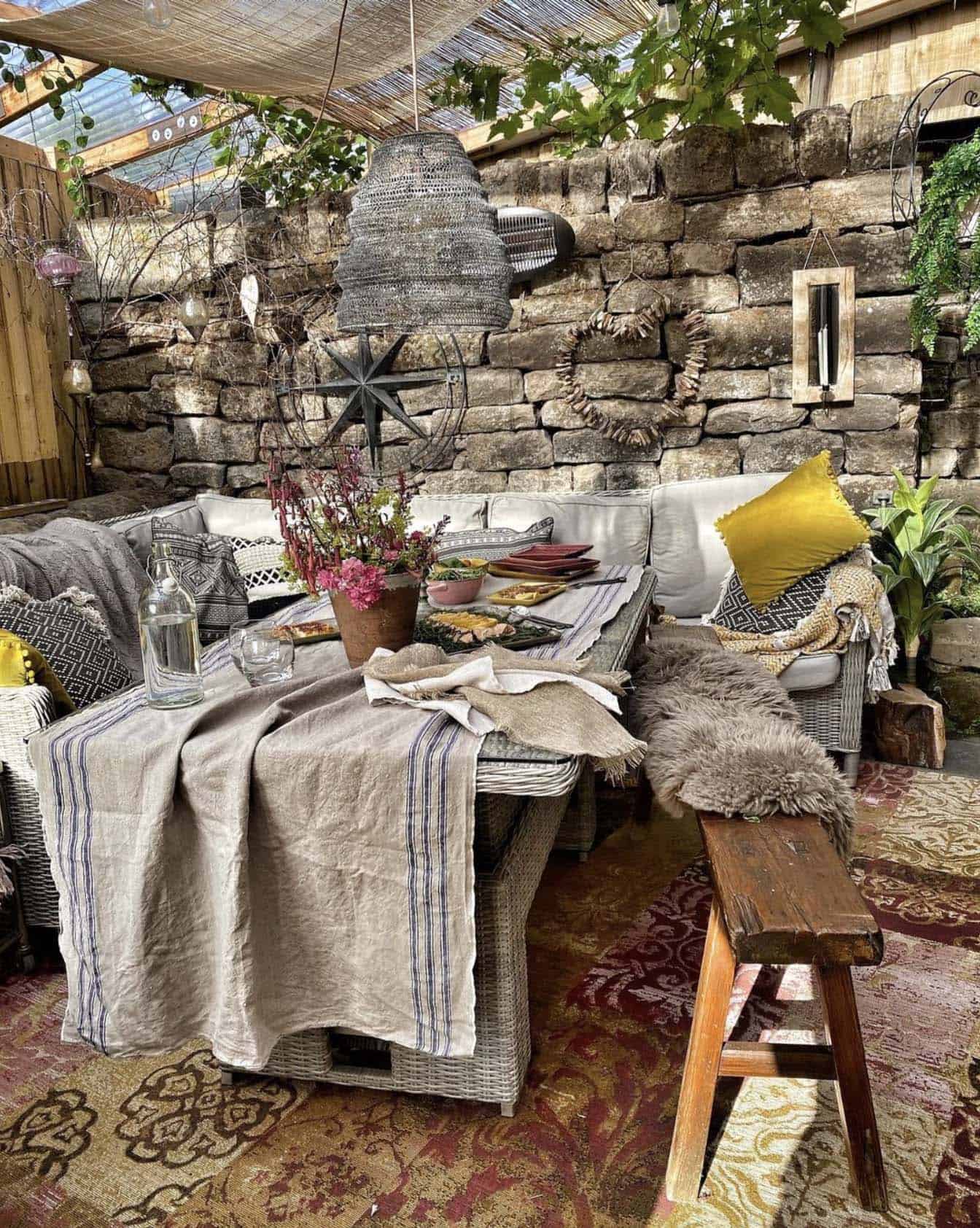 rustic patio with a pergola and outdoor dining