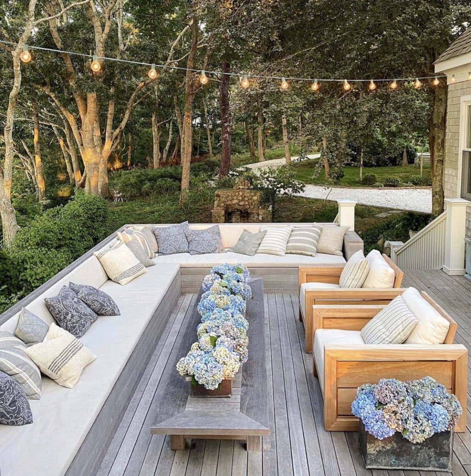back patio with built-in seating and string lights
