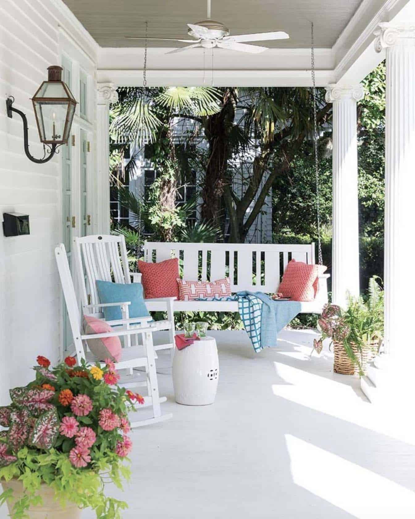 beautiful summer porch styling with a hanging swing