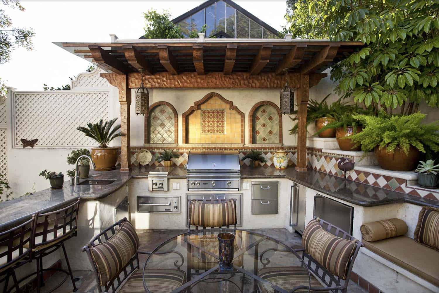 mediterranean style patio with a grill