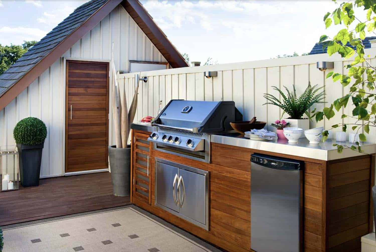 contemporary rooftop deck with a grill