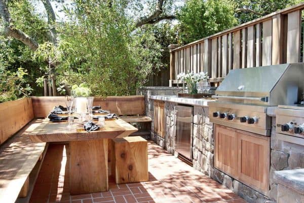 transitional patio with a grill station and alfresco dining