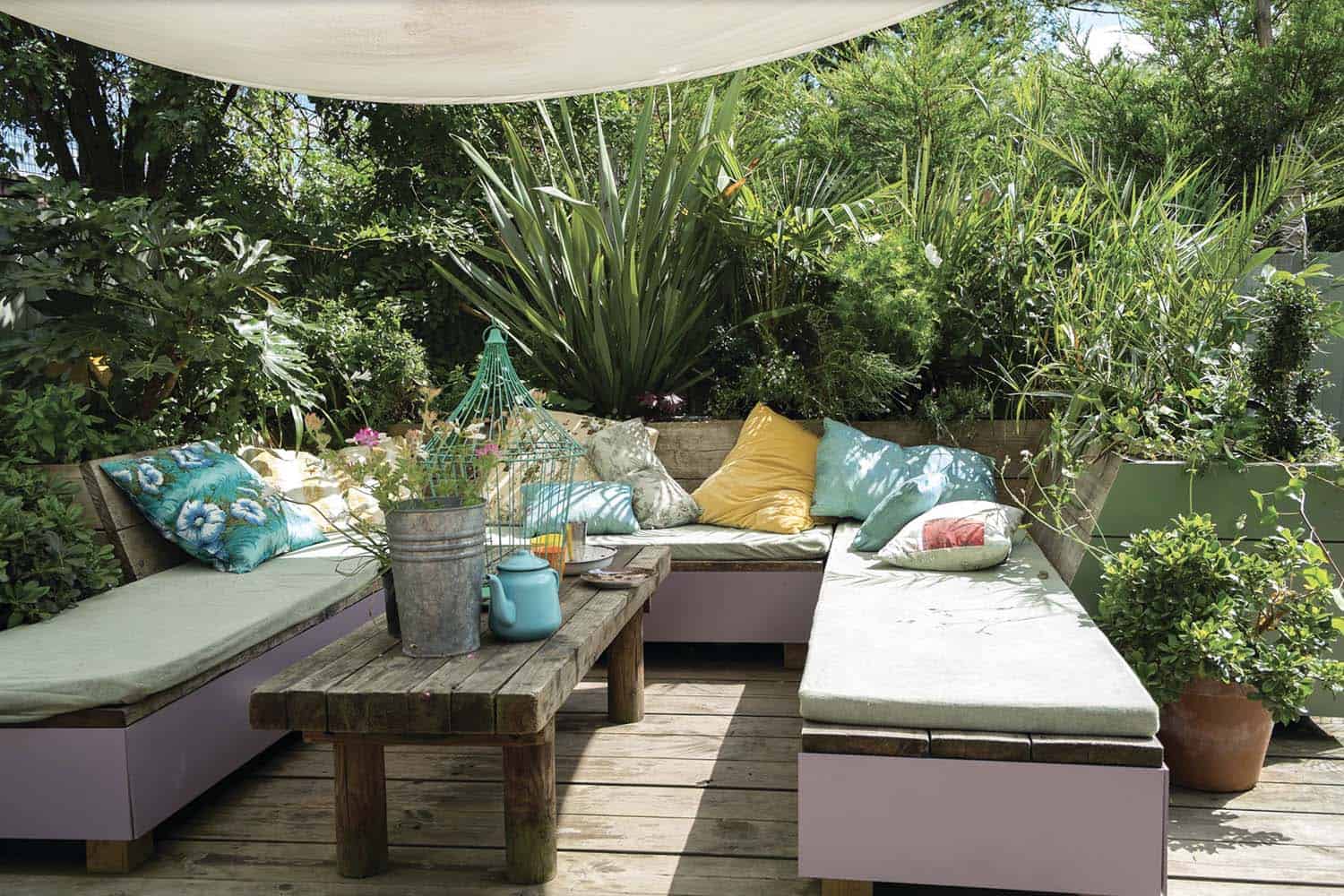 bohemian outdoor lounge with sail shades
