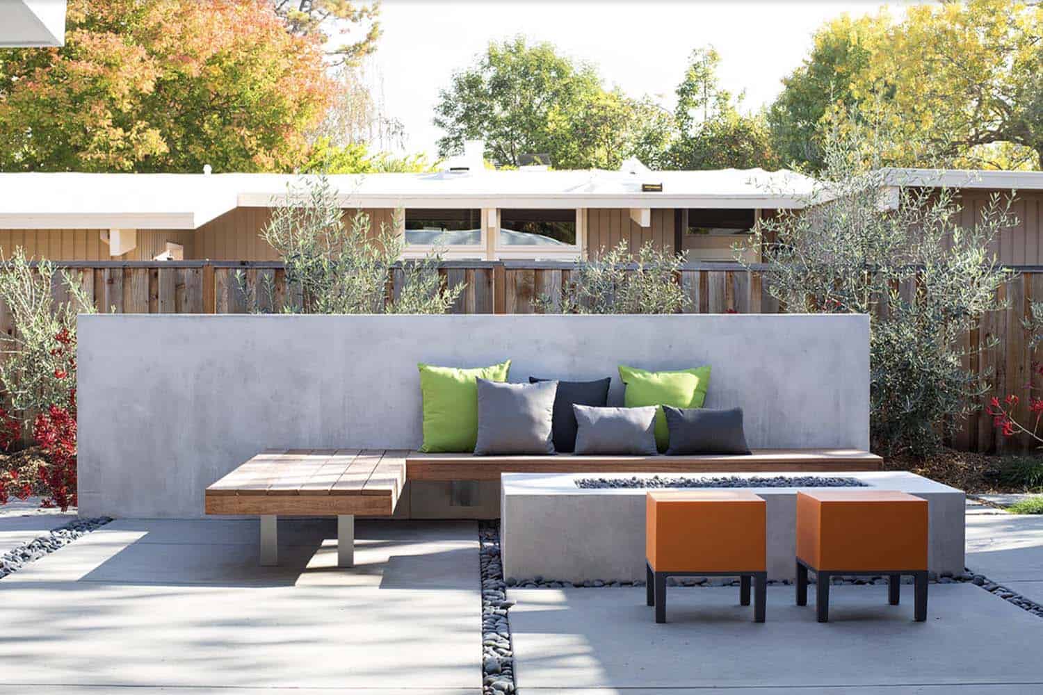 midcentury patio with a fire pit and built-in bench seating