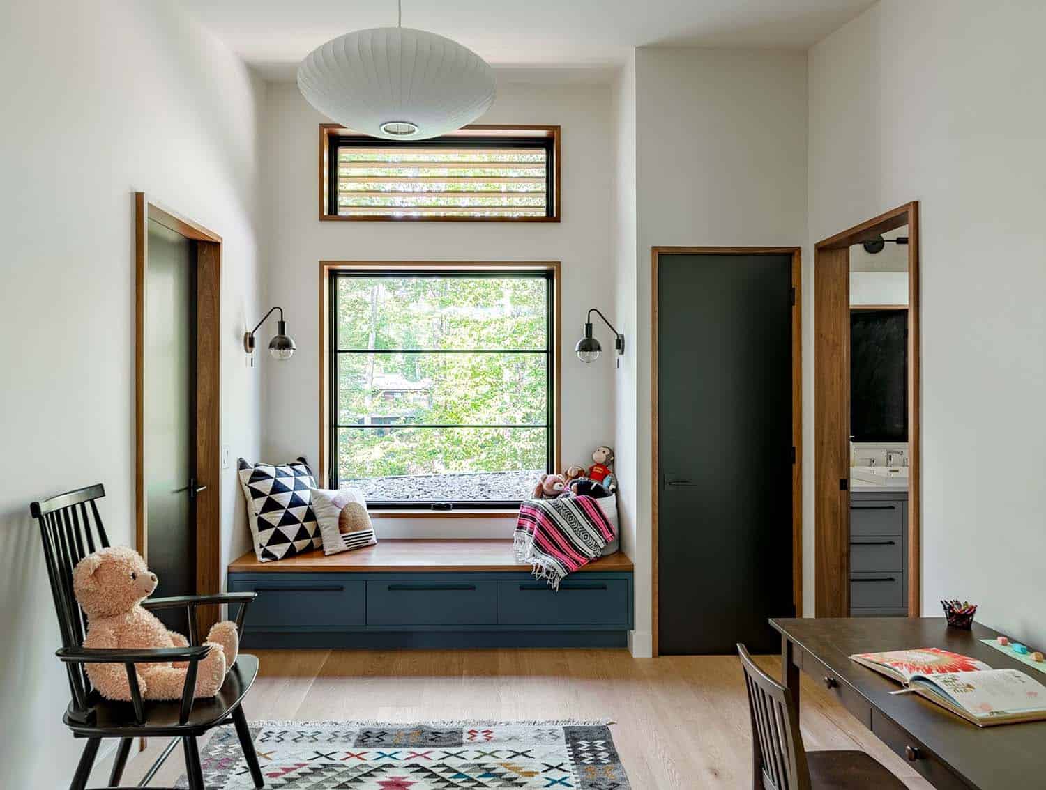 modern kids bedroom with a work desk and built-in window seat