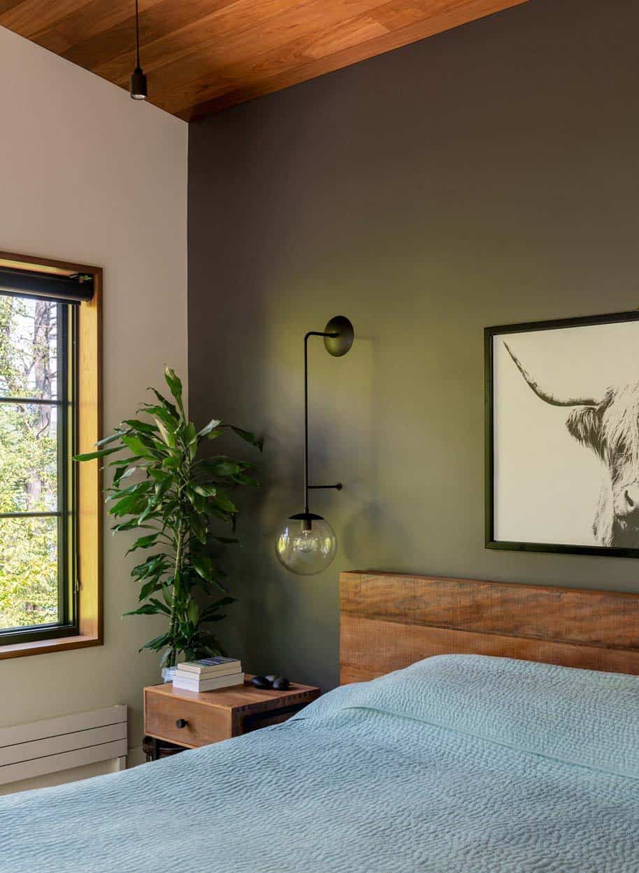 modern bedroom with a green accent wall