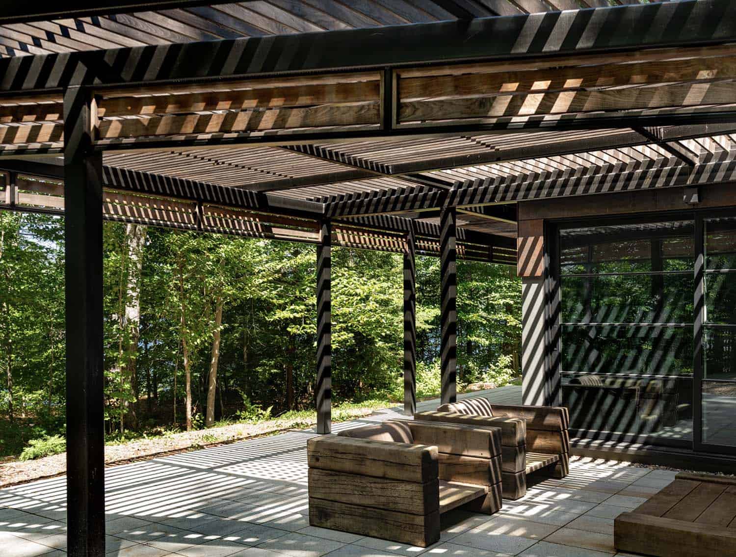 modern lake house patio with a trellis
