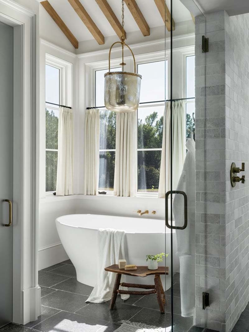 contemporary bathroom with a freestanding tub and shower