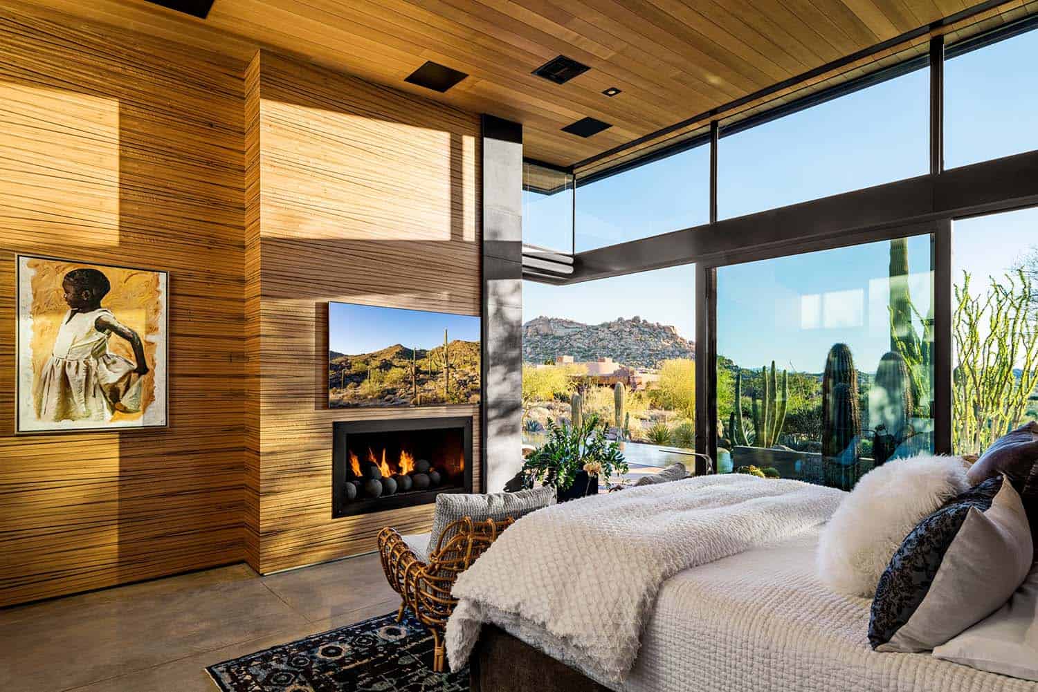 contemporary bedroom with a fireplace