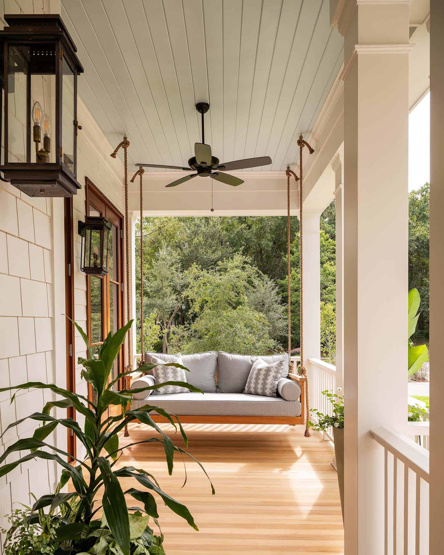 contemporary front porch with a hanging chair