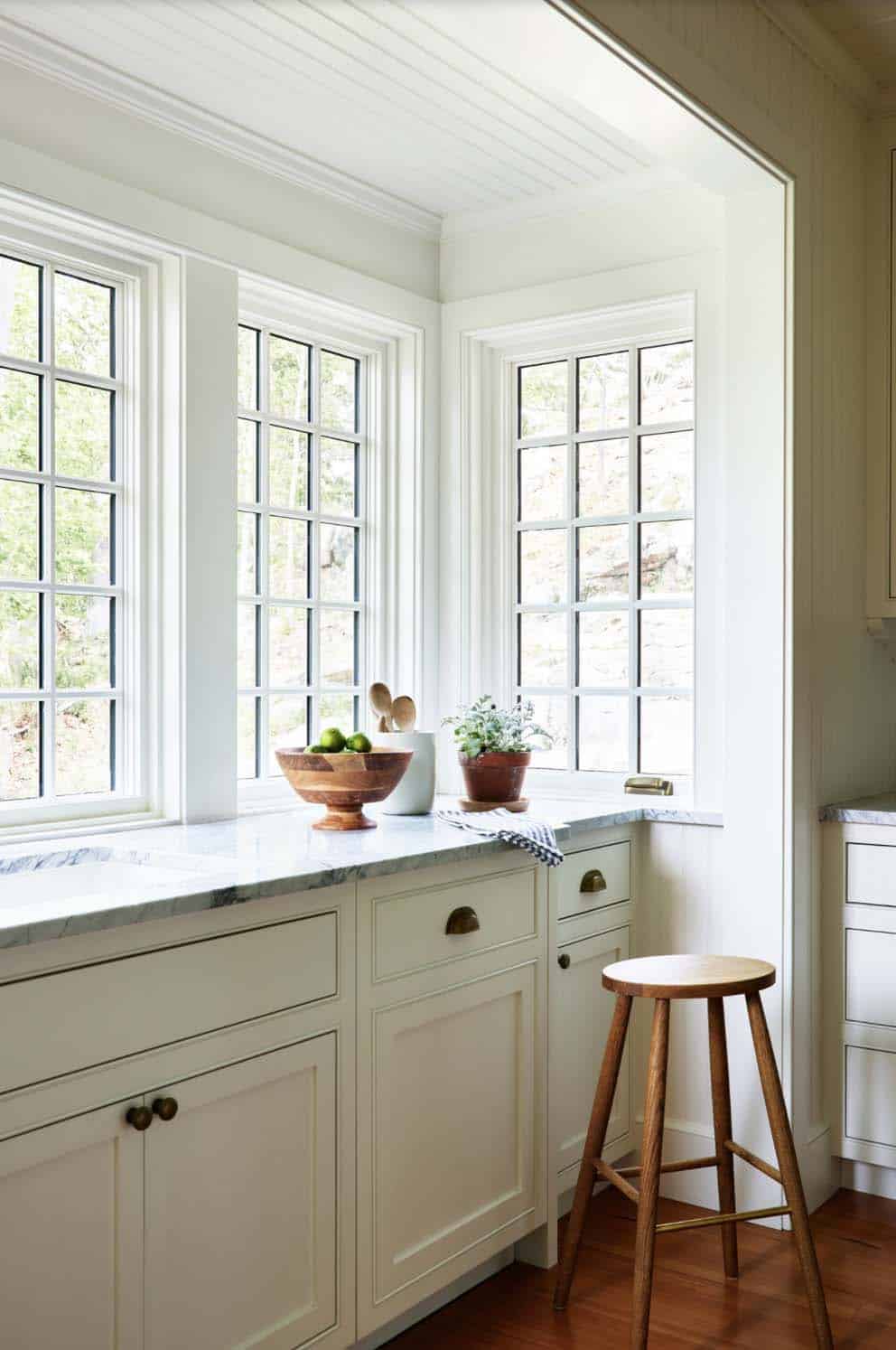beach style kitchen with a oriel window extension