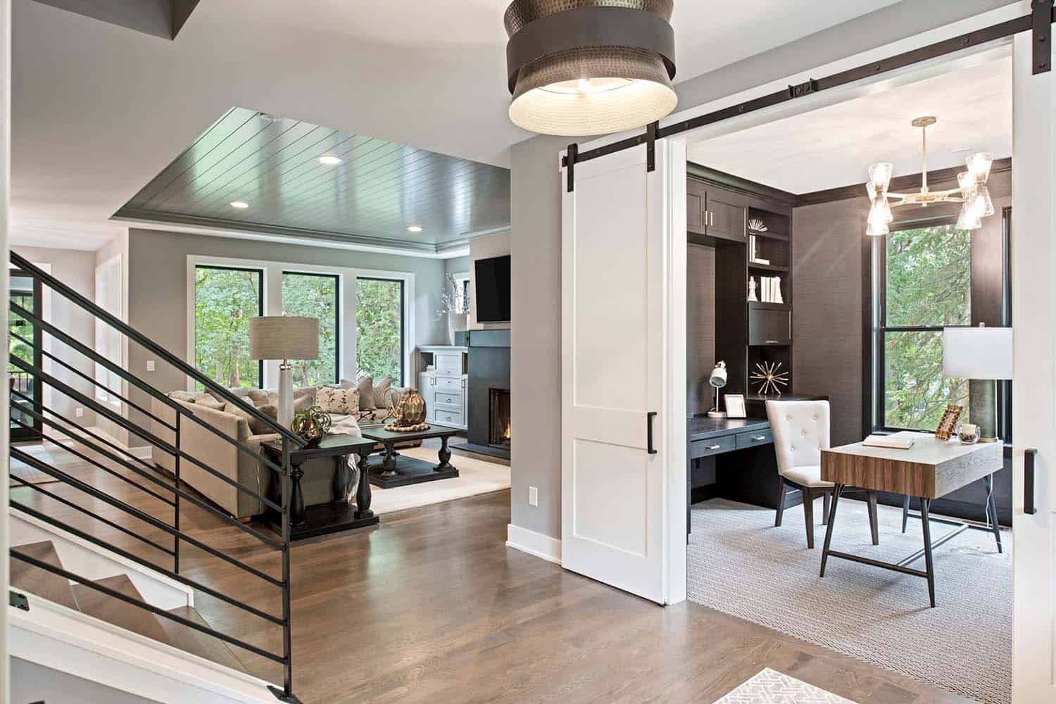 modern farmhouse entry and sliding barn door leading into the home office