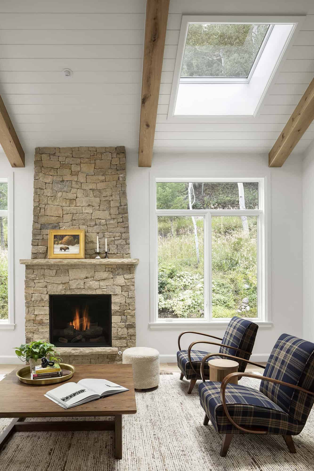 farmhouse style living room with a fireplace 