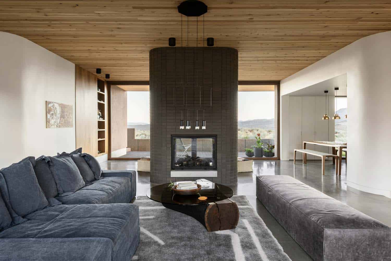 modern living room with a dual-sided fireplace