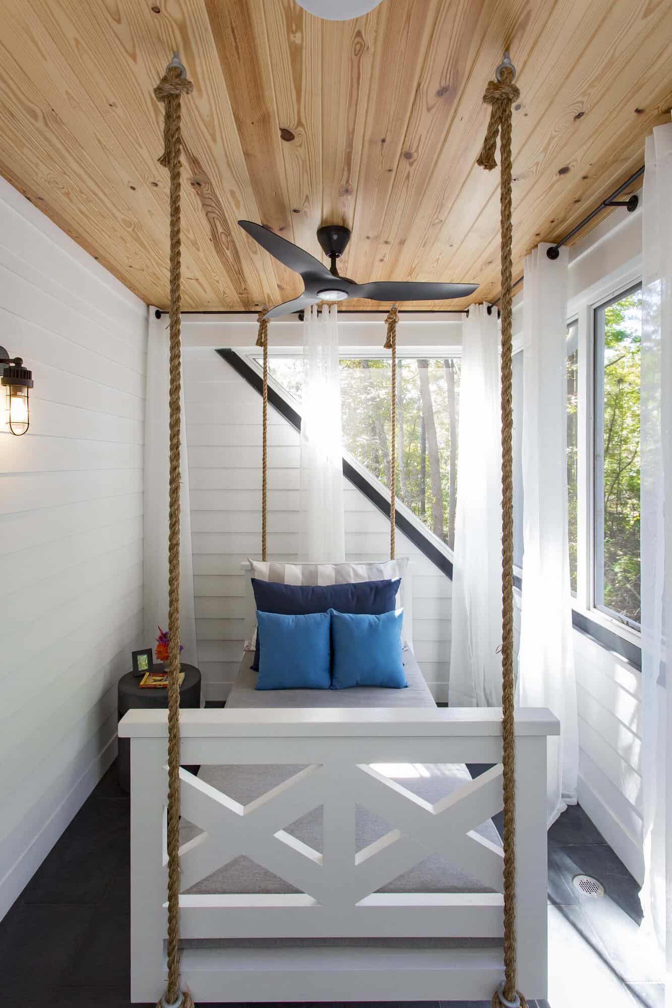 modern farmhouse balcony with a hanging swing