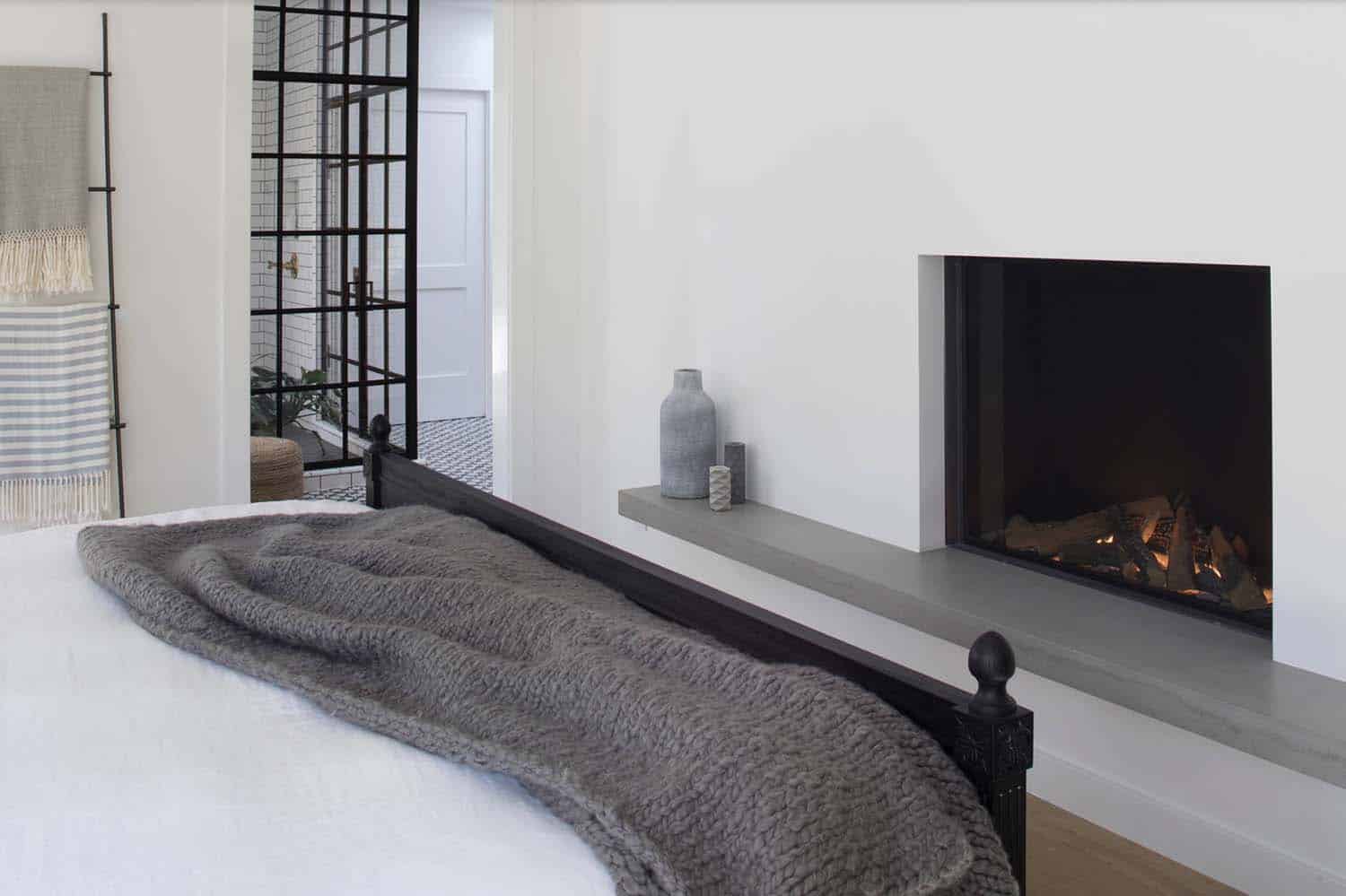 transitional bedroom with a fireplace