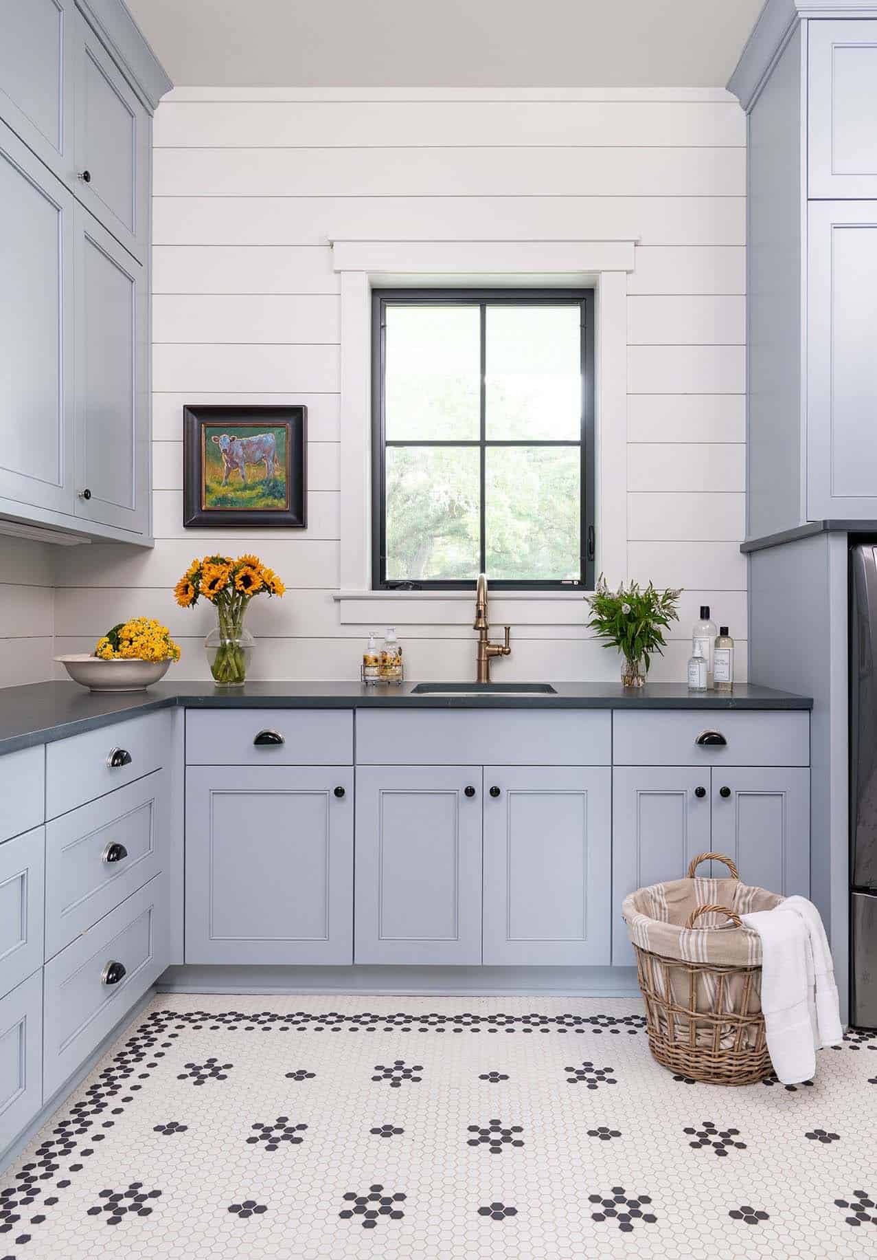 modern farmhouse laundry room with blue cabinets