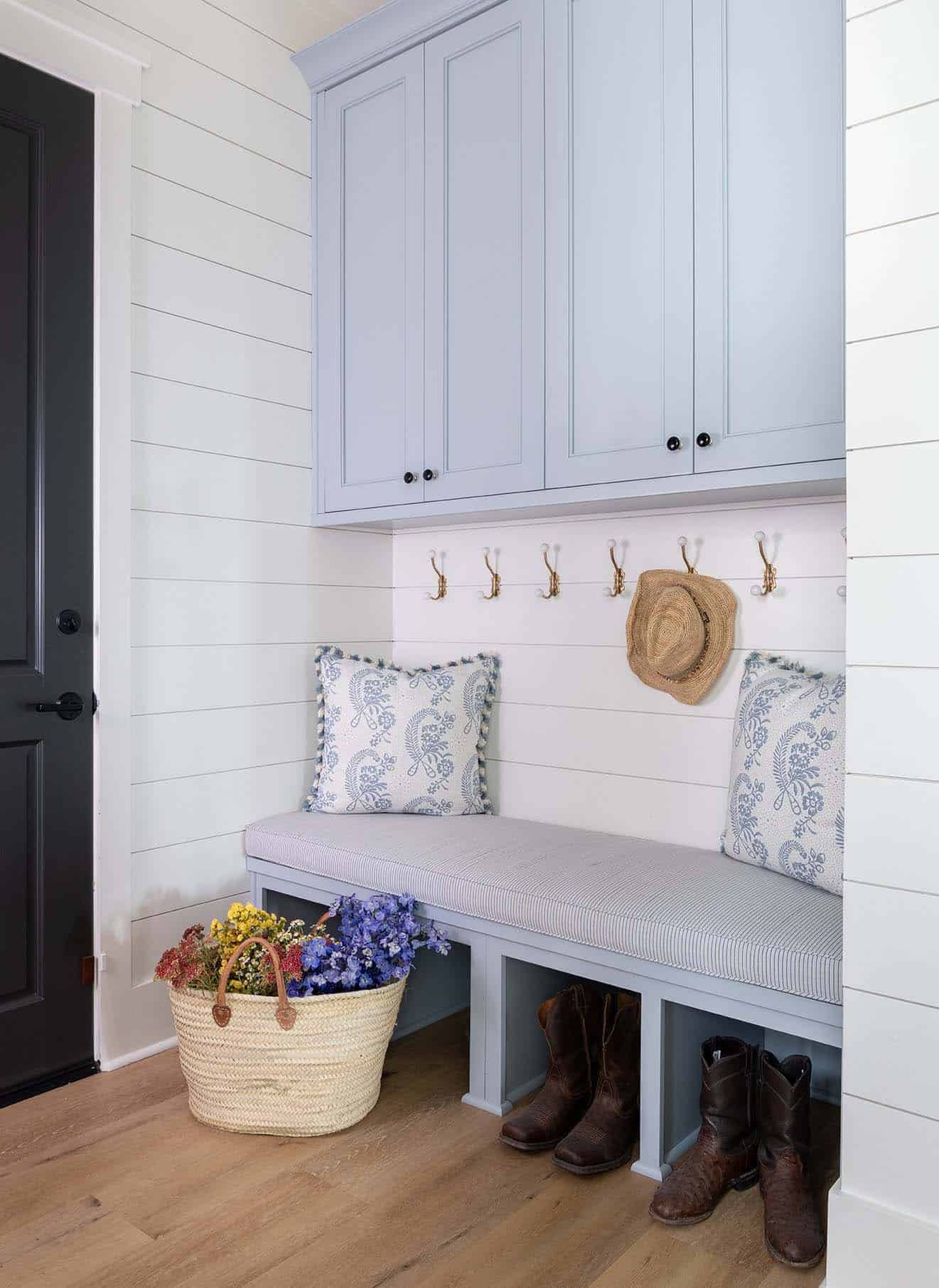 modern farmhouse mudroom with a built-in bench and upper cabinet