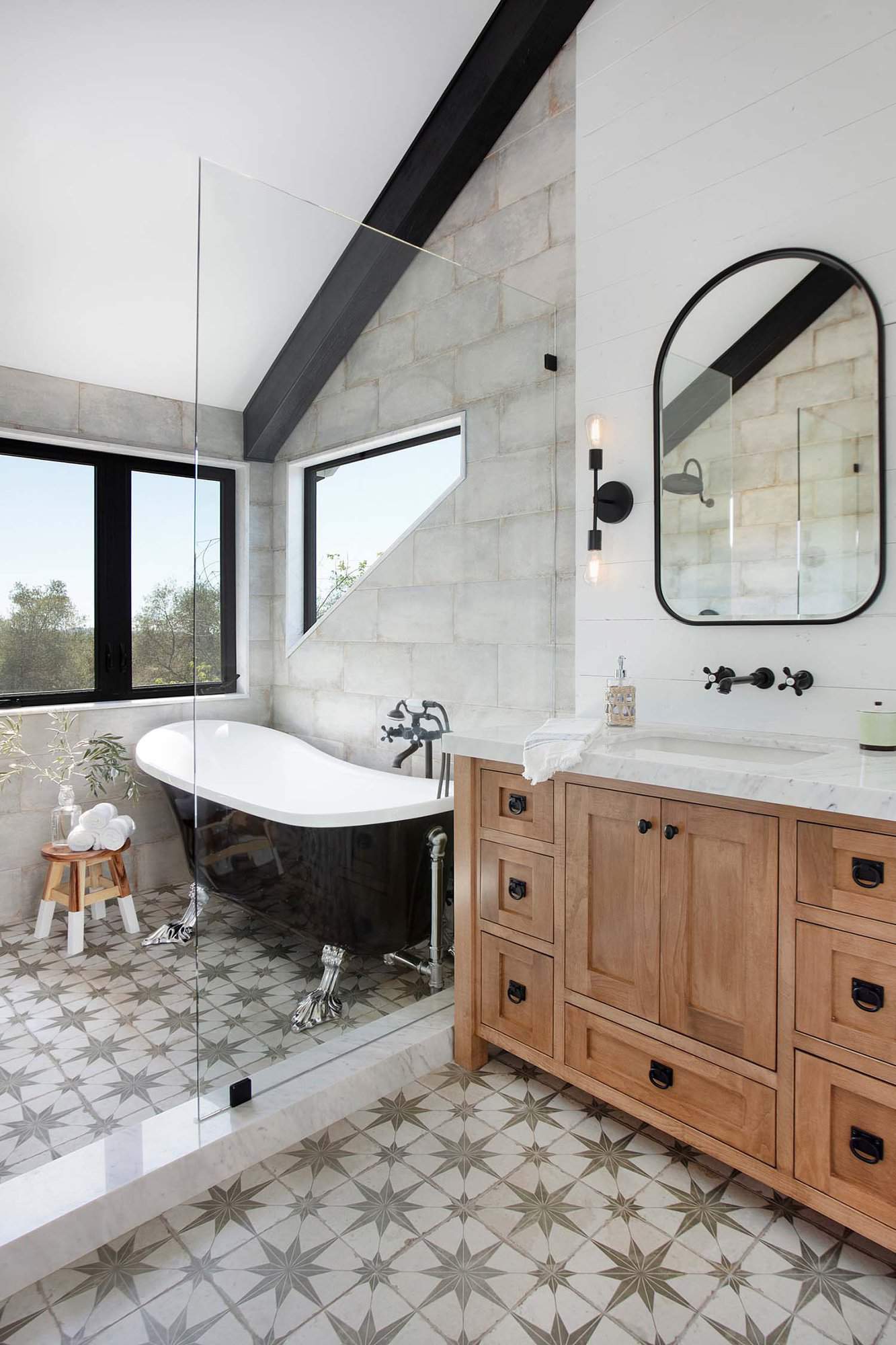 modern farmhouse bathroom with a vanity and shower/bath combo