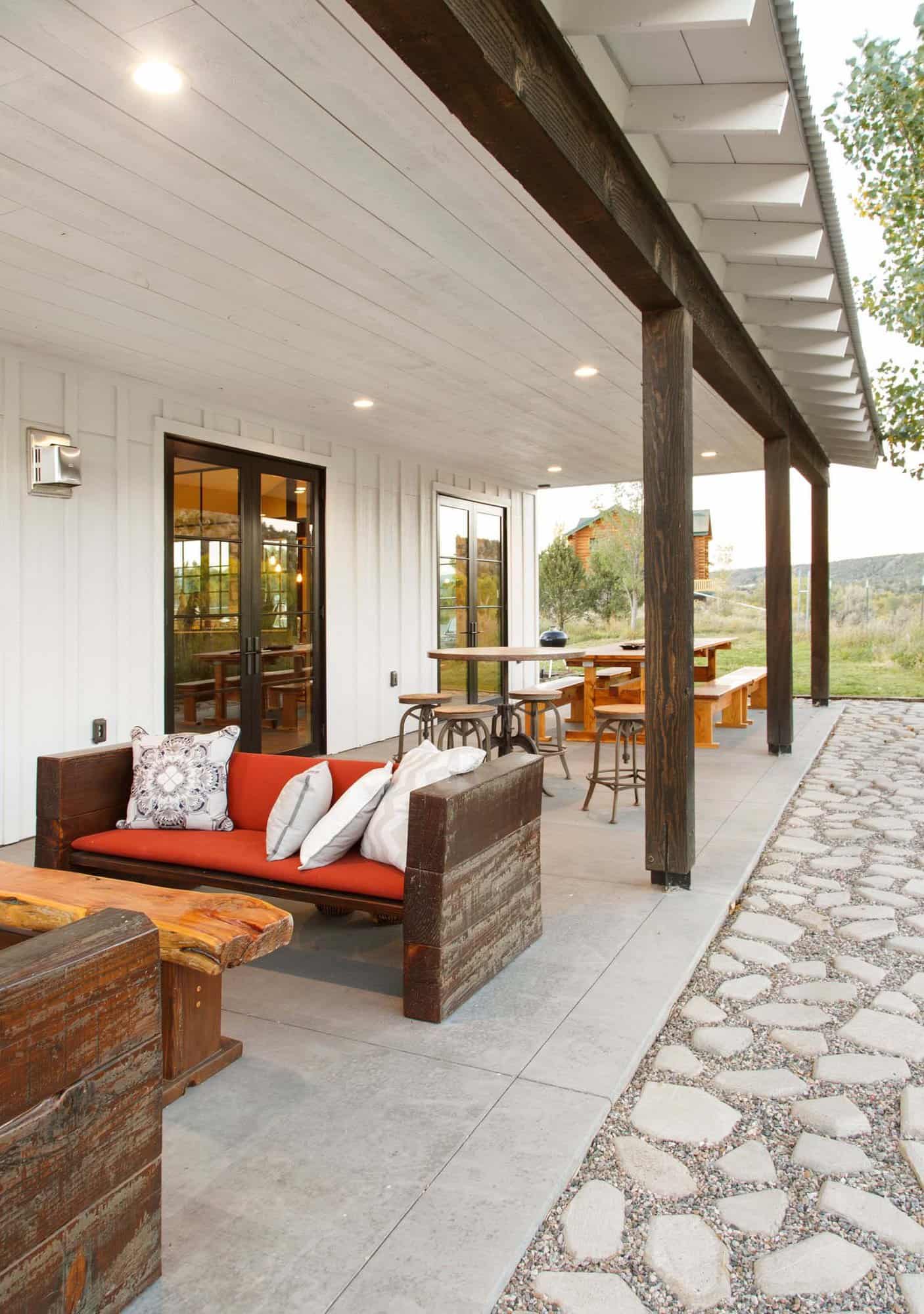 modern farmhouse covered porch with outdoor furniture
