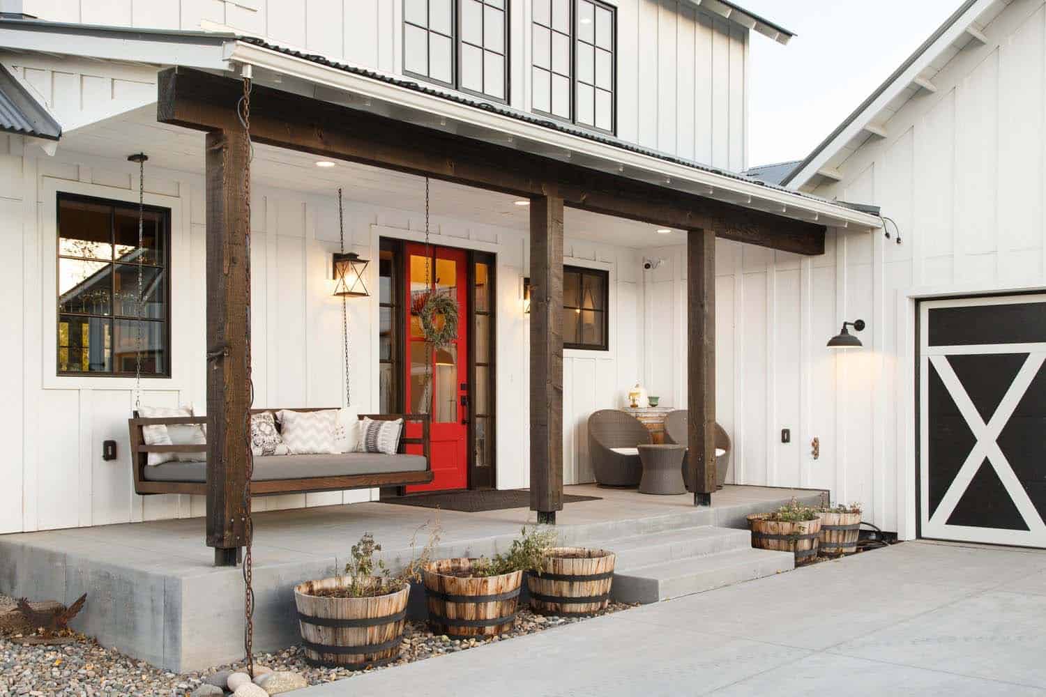 modern farmhouse front porch with a red door