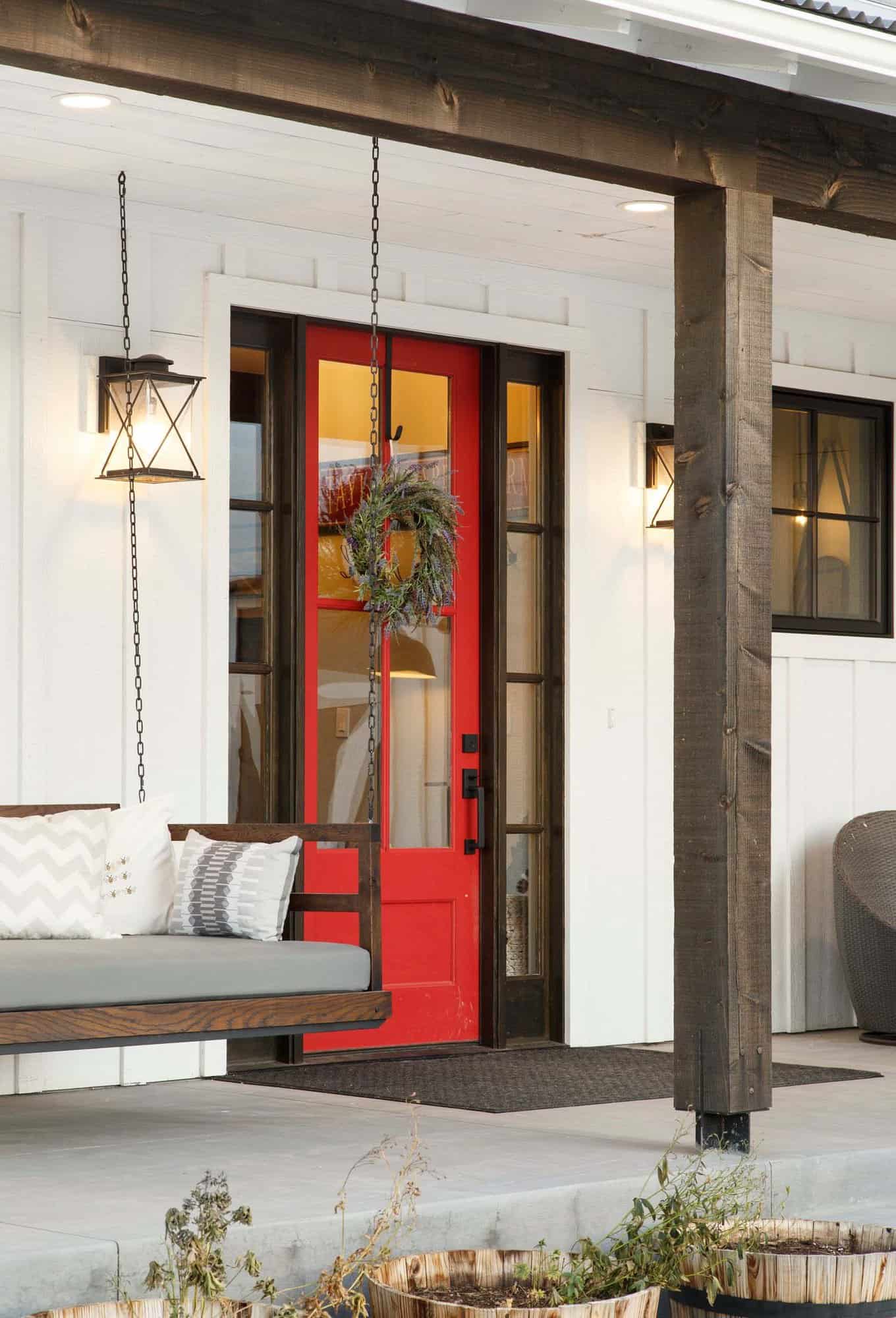 modern farmhouse front porch with a red door