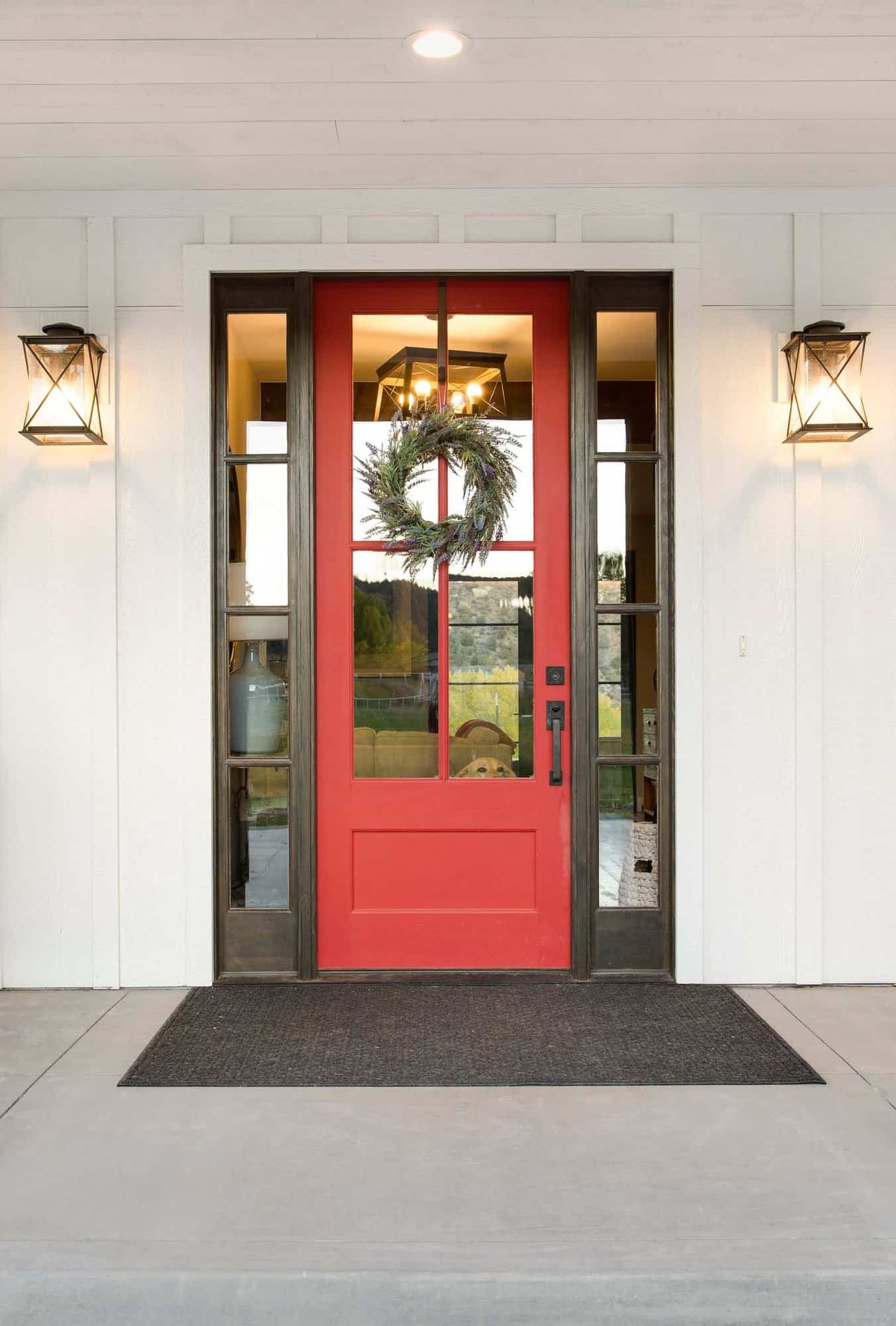 modern farmhouse entry with a red door