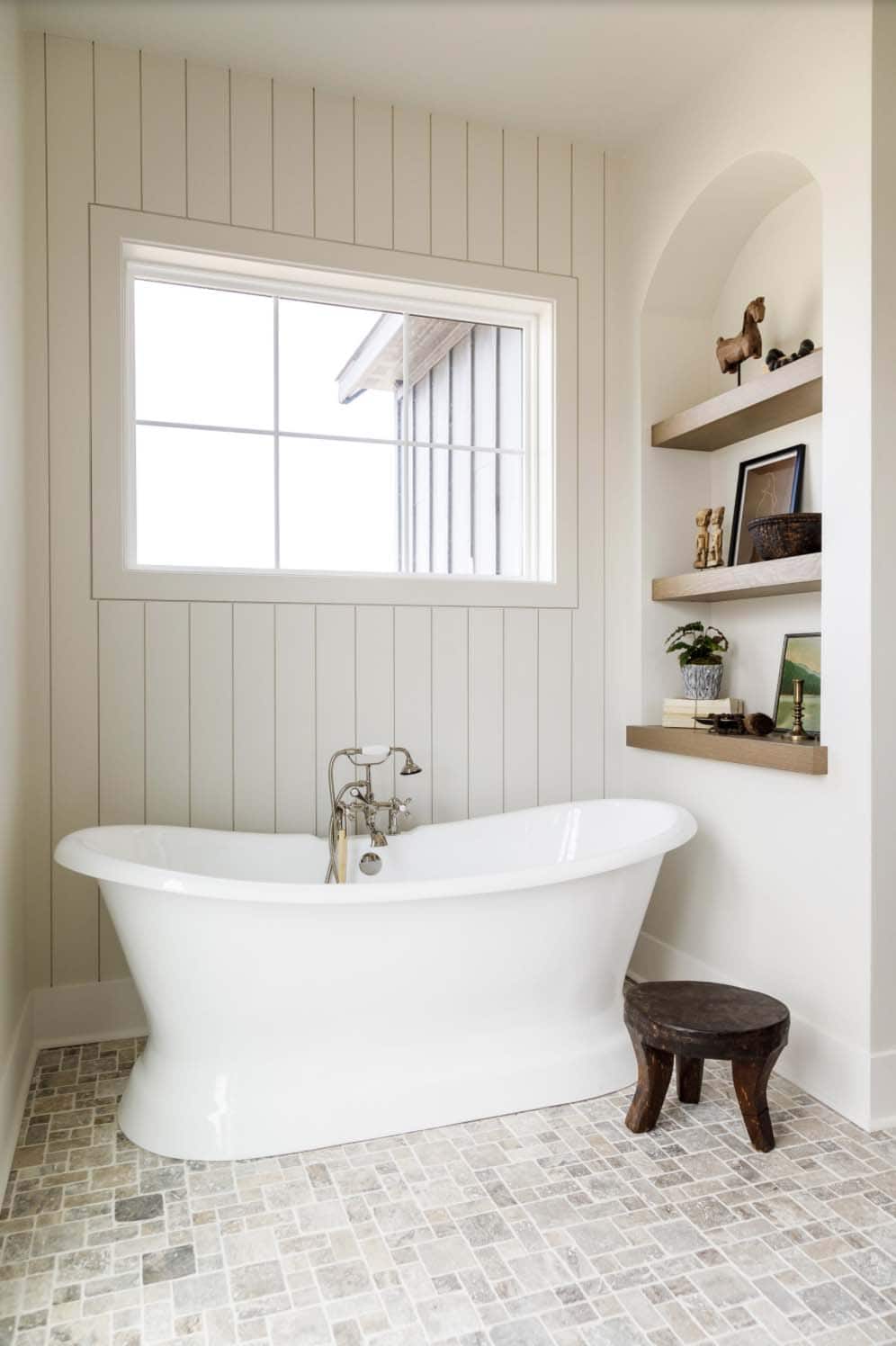 farmhouse style bathroom with a freestanding tub