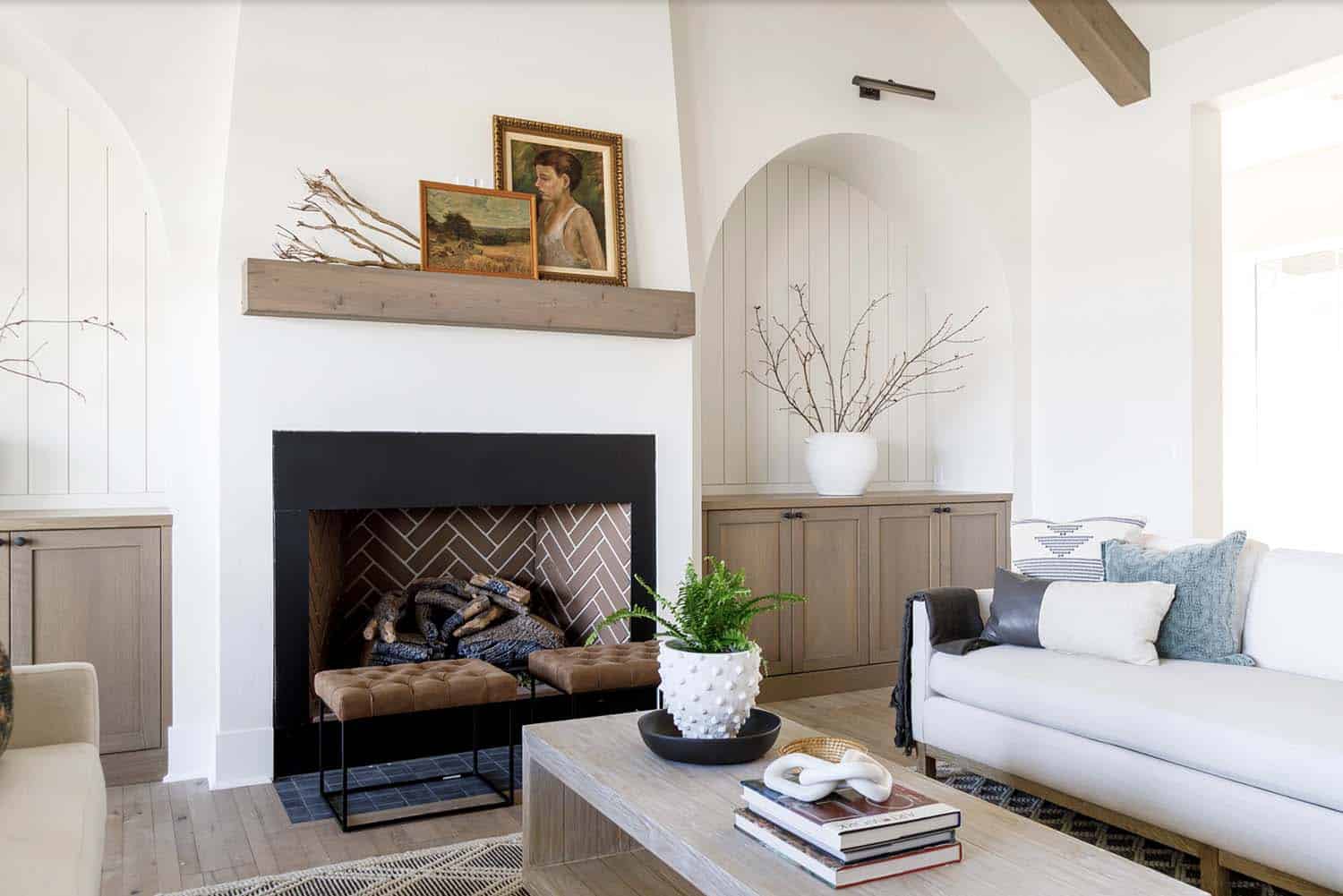 farmhouse style living room with a fireplace