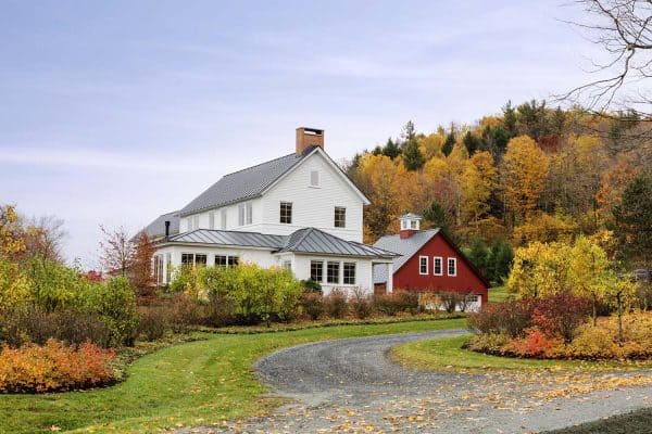 modern farmhouse exterior with a red barn