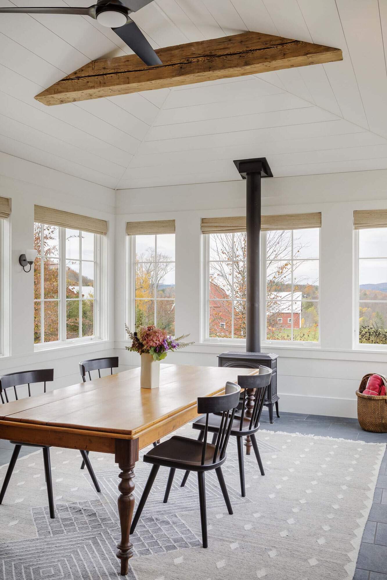 modern farmhouse dining room with a fireplace stove