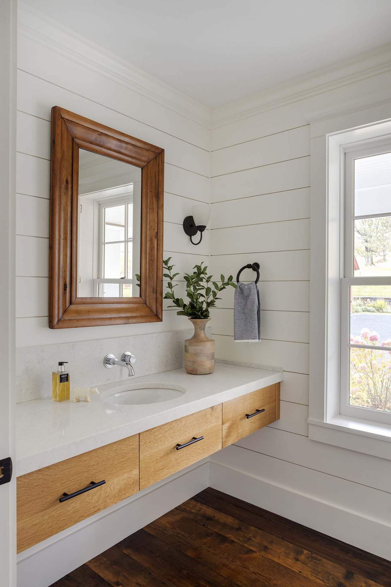 modern farmhouse powder room with a floating vanity