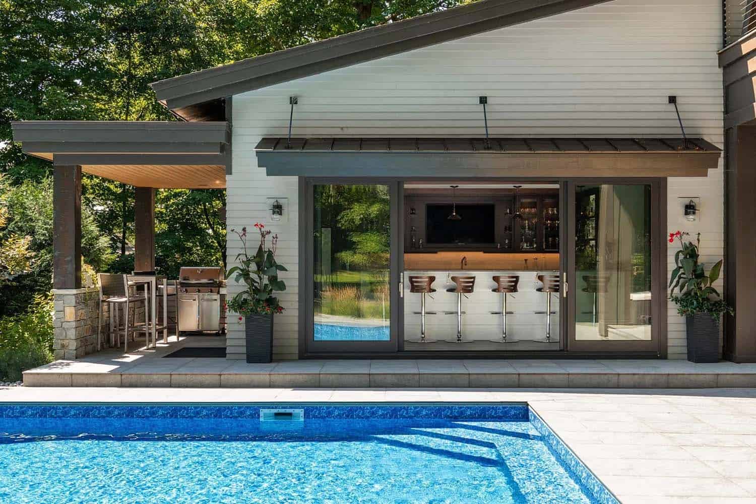 modern lake house backyard with a pool