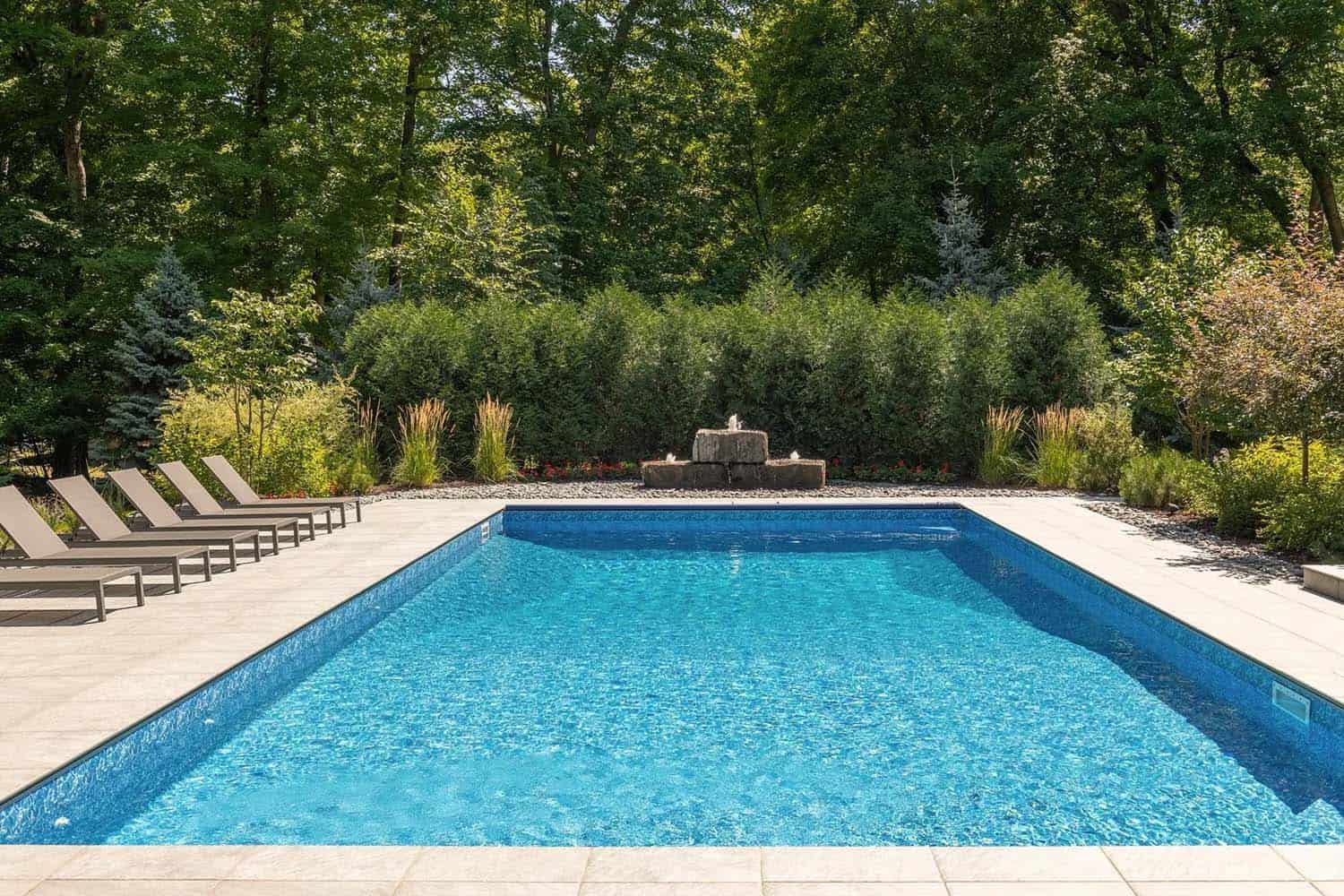 modern lake house backyard with a pool