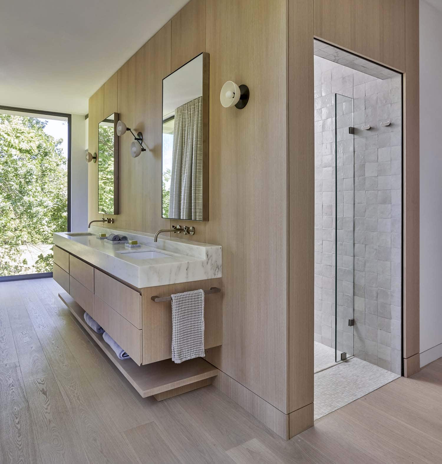 modern bathroom with a floating vanity and walk-n shower
