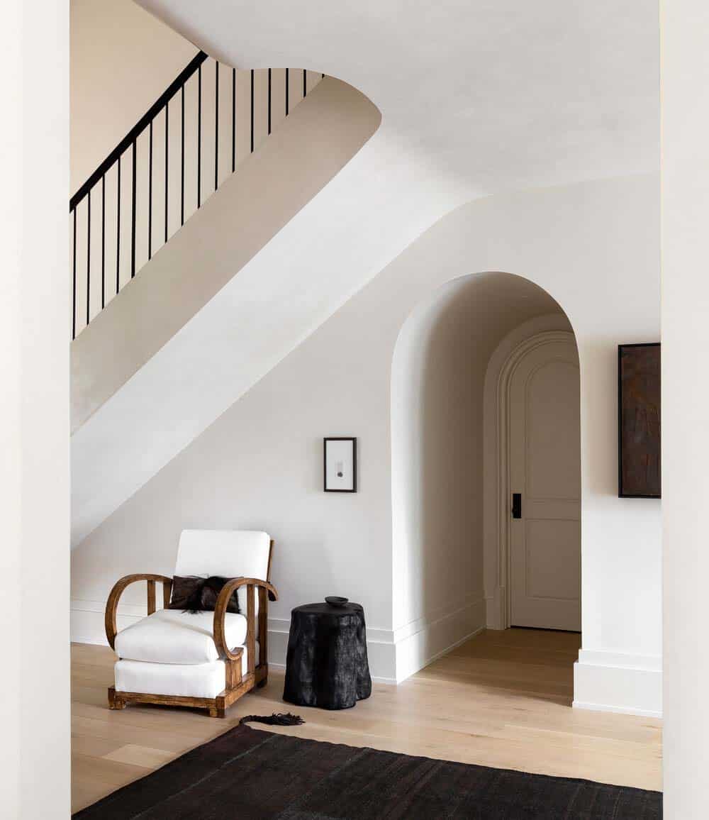 modern rustic staircase with a door under the stairs