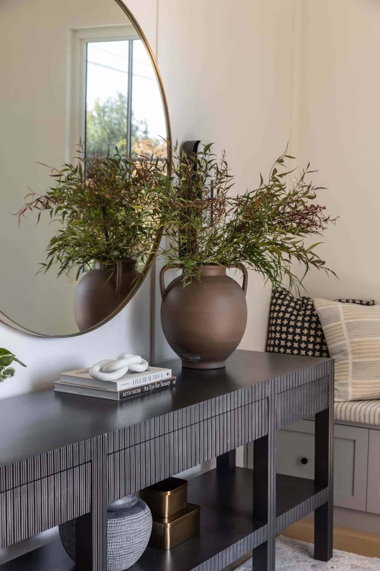 transitional style home entry with a console table