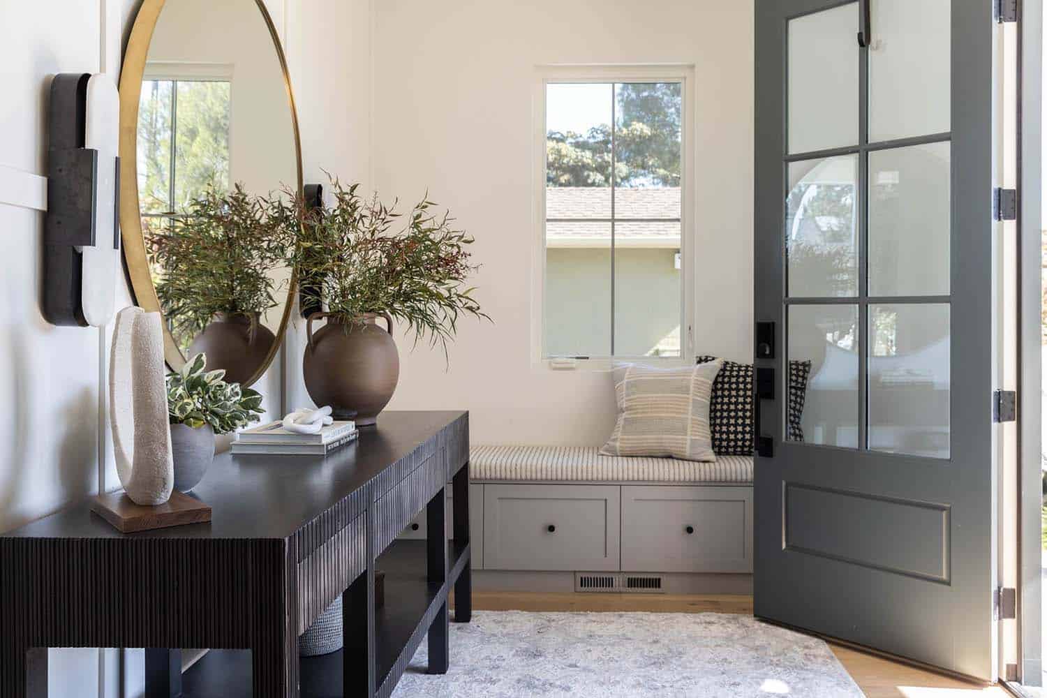 transitional style home entry with a console table