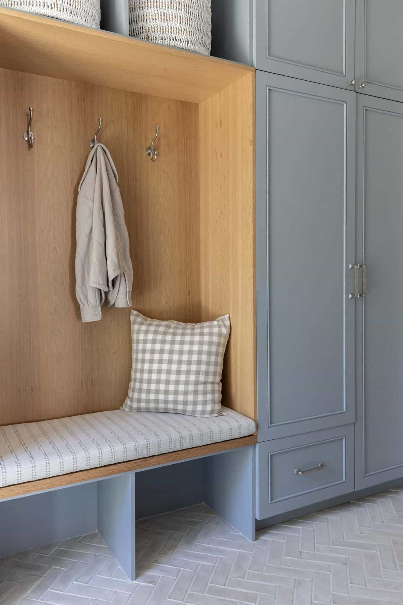transitional style mudroom storage with a bench