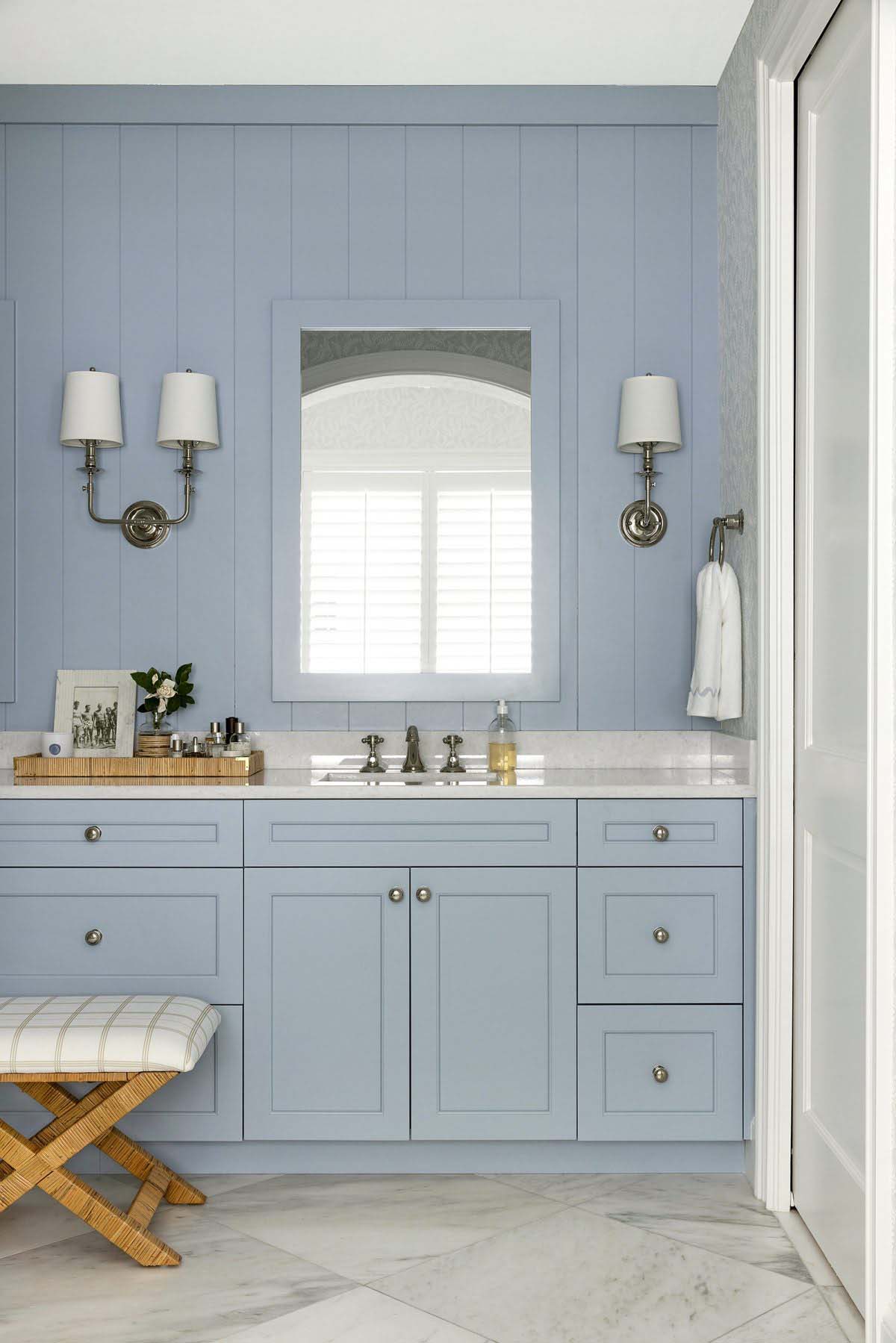 coastal style bathroom with a blue vanity