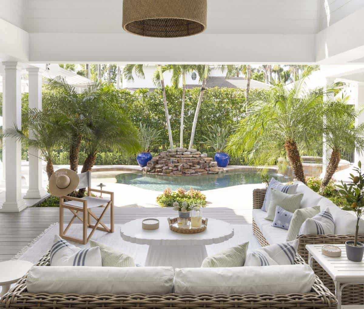 coastal style covered porch with outdoor furniture