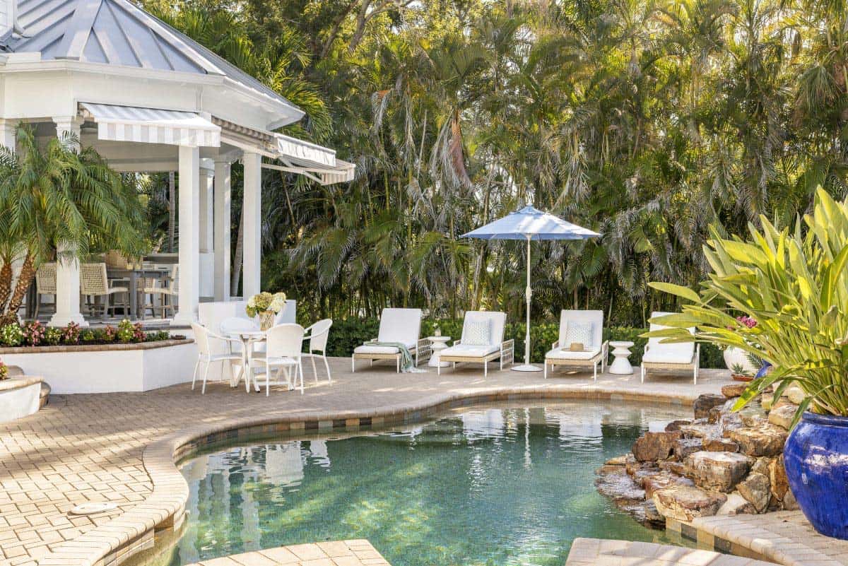 coastal style patio with a swimming pool