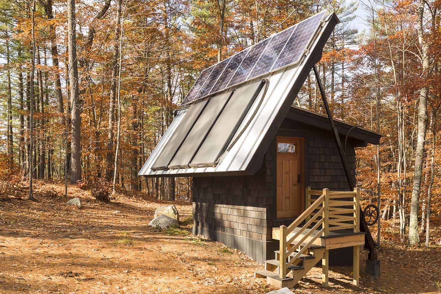 off-the-grid island camp exterior with a solar panel