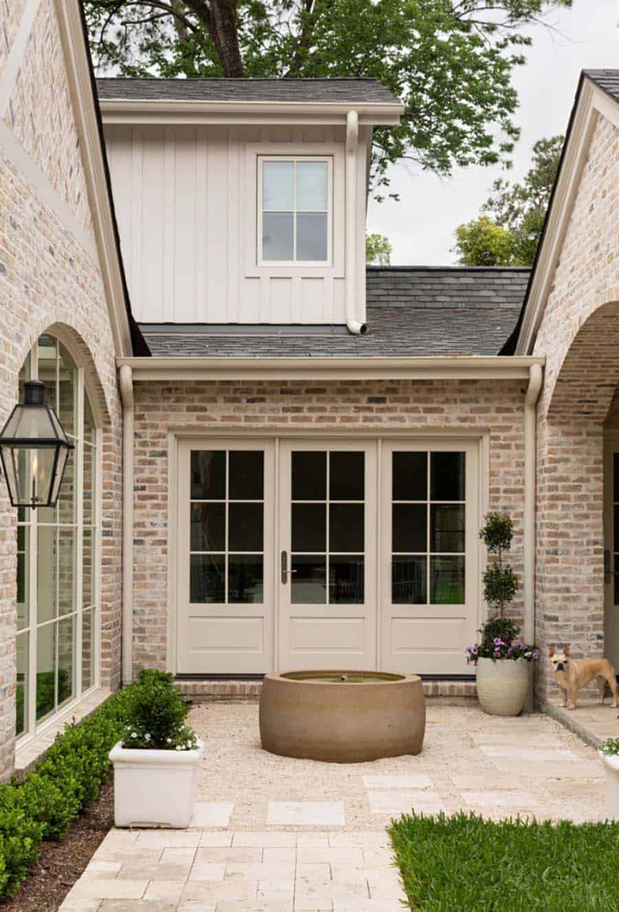 traditional home exterior patio with a water feature