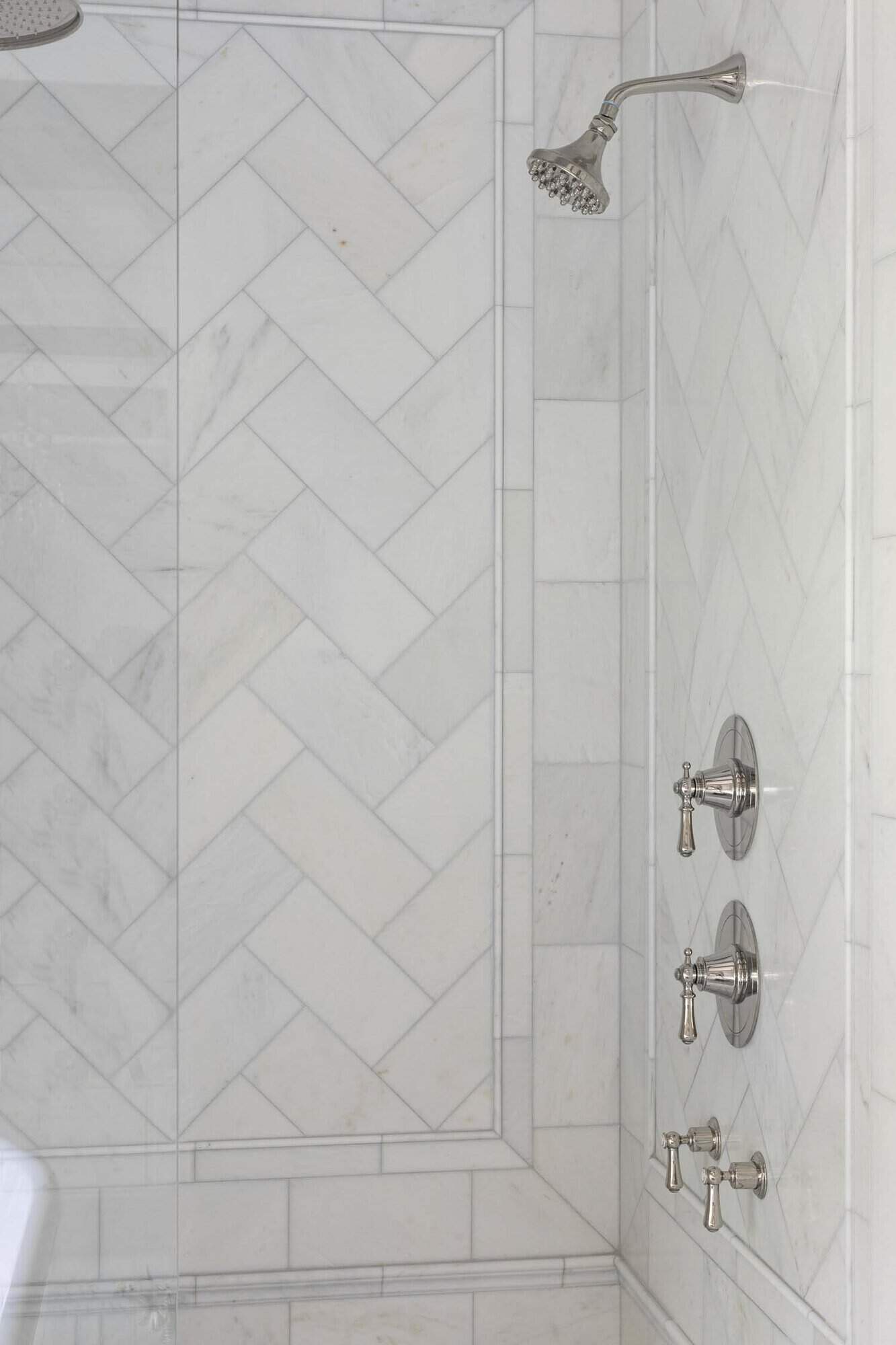 traditional bathroom shower with white tile