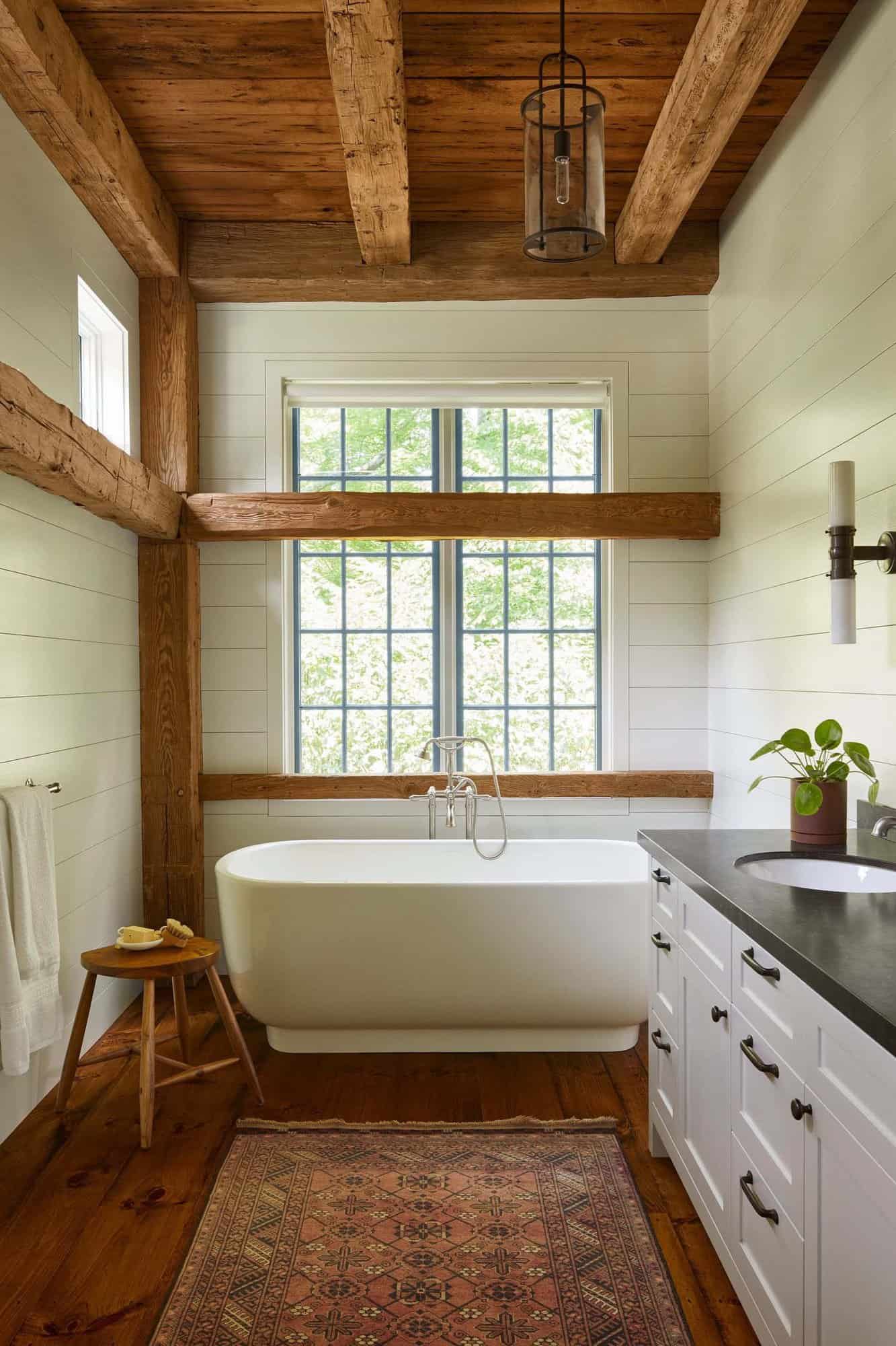 modern rustic bathroom with a freestanding tub