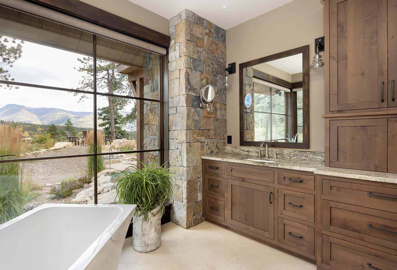 traditional style bathroom with a vanity and freestanding tub