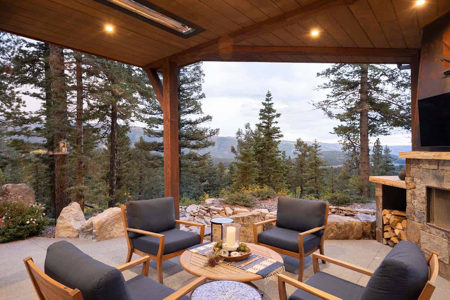 traditional mountain timber home covered patio with mountain views